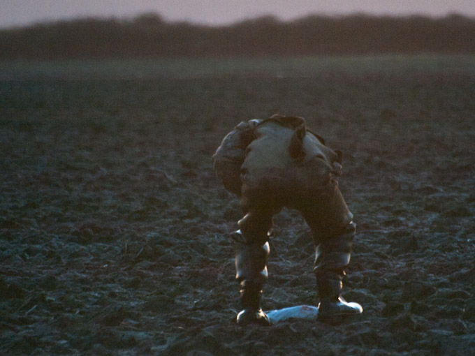 Hunter Retrieving Shot Snow Goose