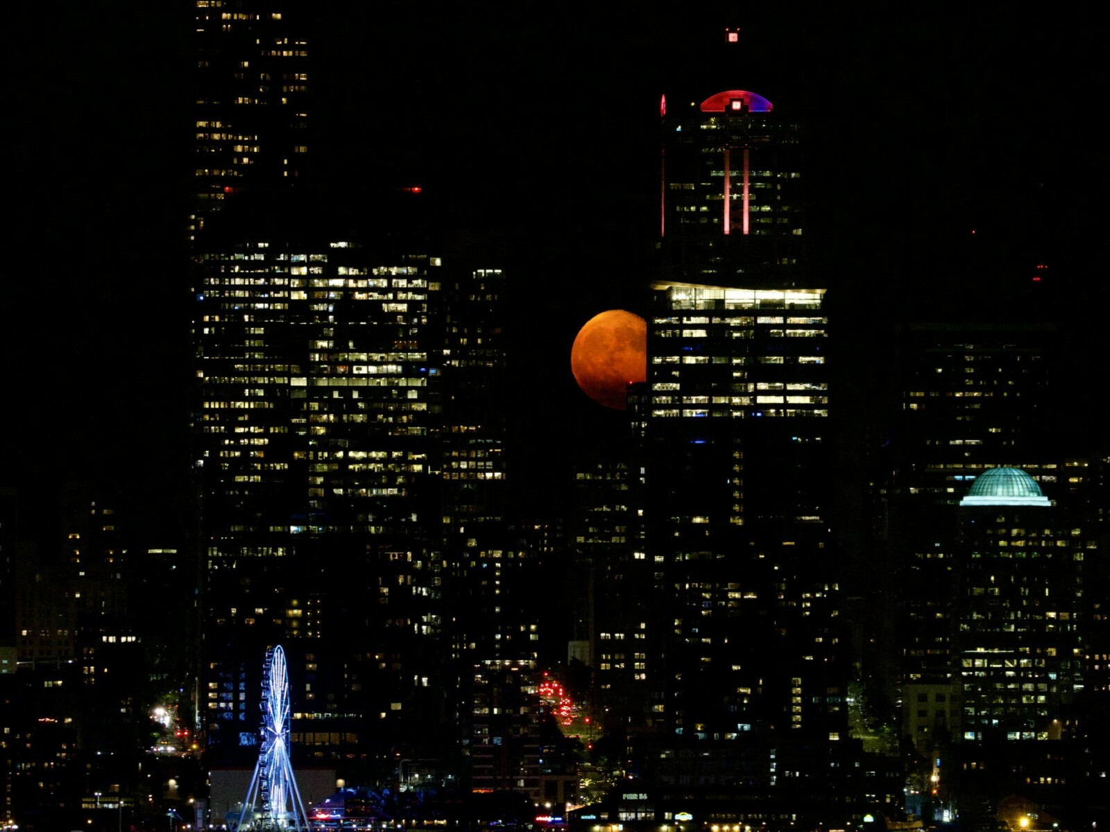 Orange Moon Over Seattle City Skyline