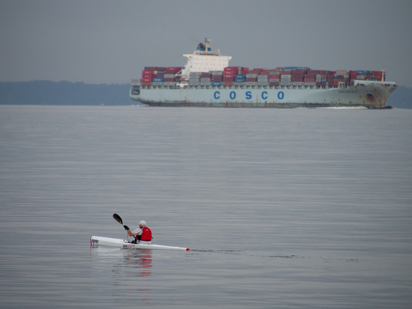 Kayaker on Puget Sound with Cosco Container Ship