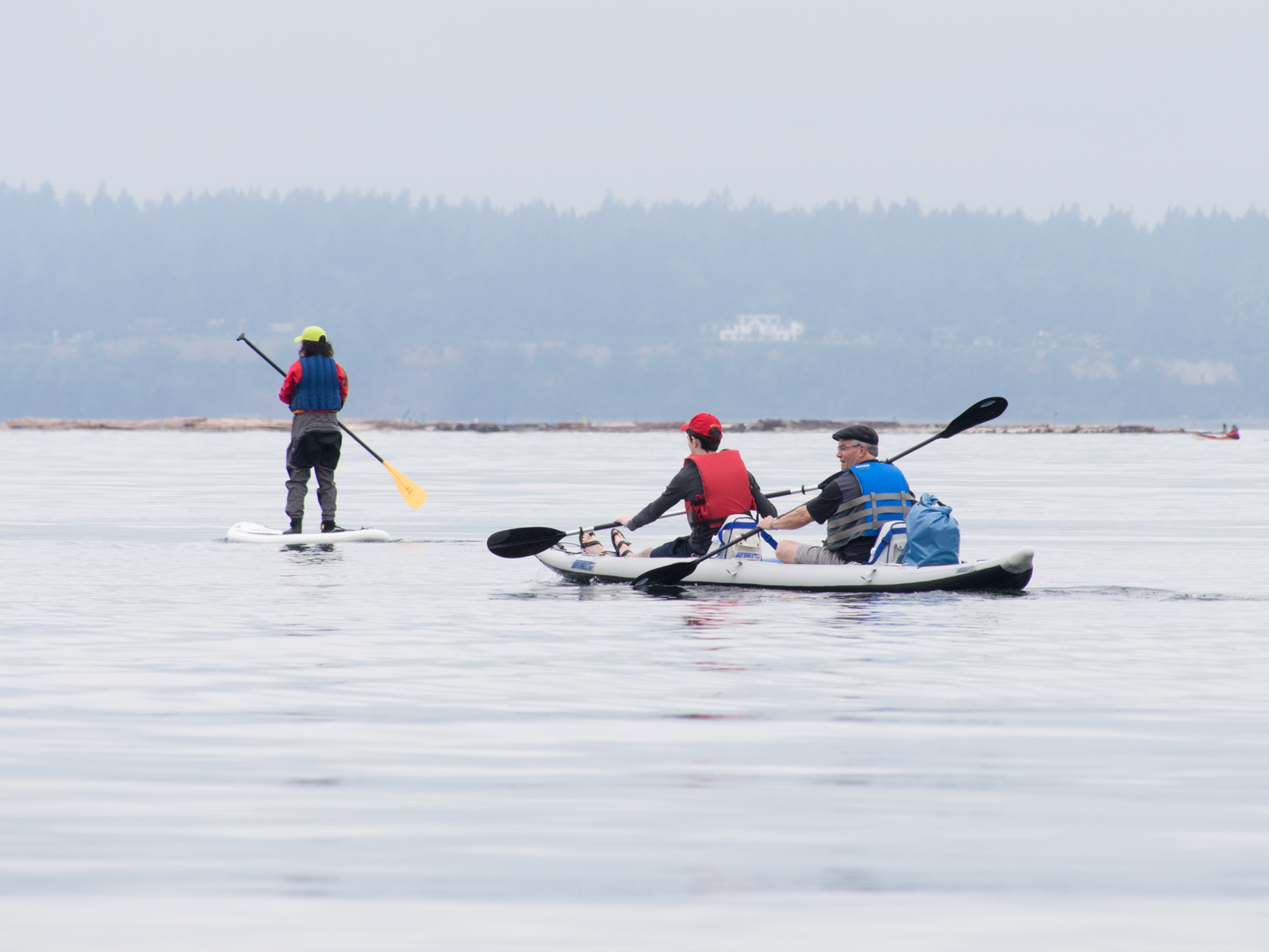 Kayakers and Paddler at Golden Gardens Seattle